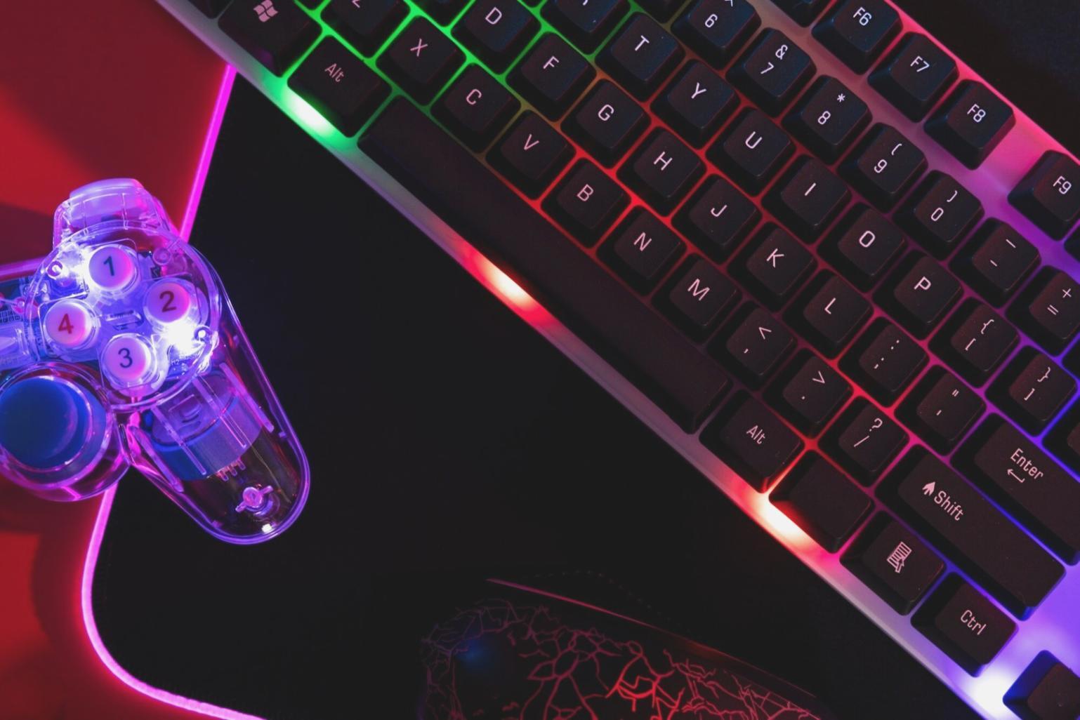 Professional esports analytics workspace showing multiple monitors with game statistics and performance data